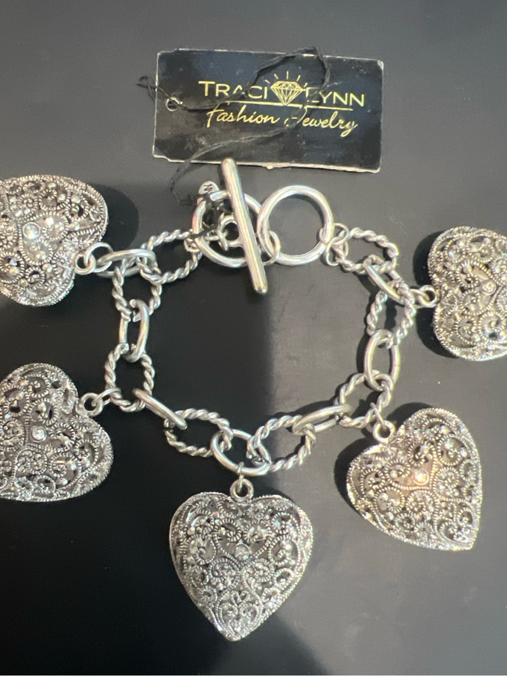 Traci Lynn Silver Filigree Heart Charm Bracelet